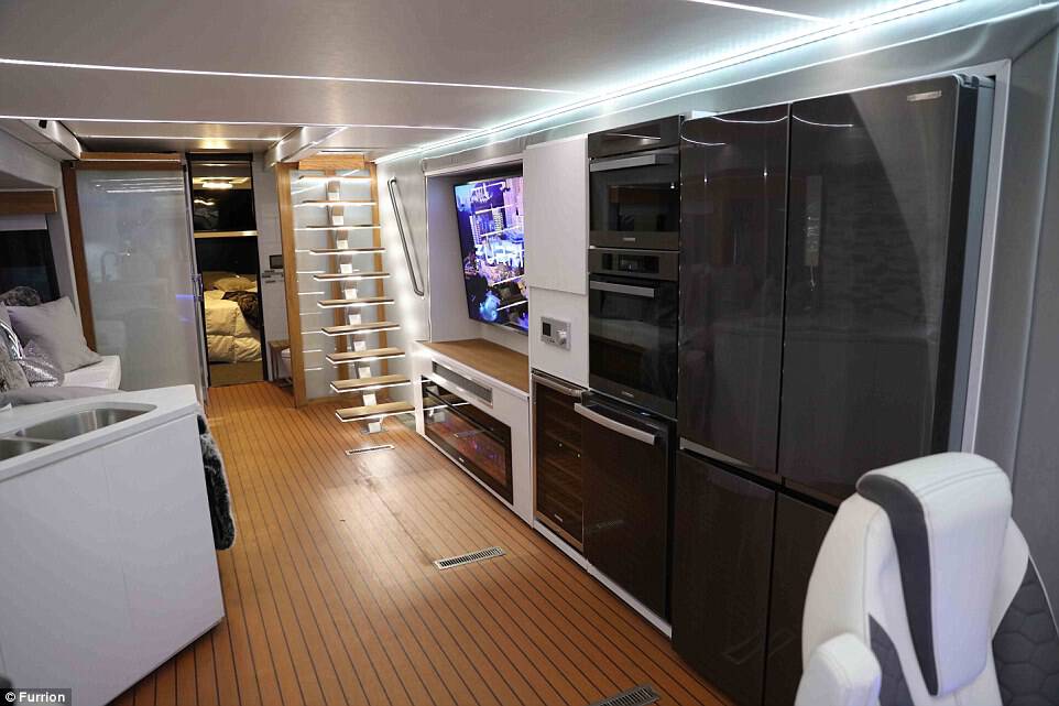 The interior of the stunning RV (pictured) is better-equipped than most people's apartments