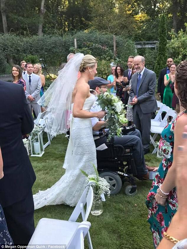 The couple head down the aisle on their wedding day, nine months after Brett was paralyzed