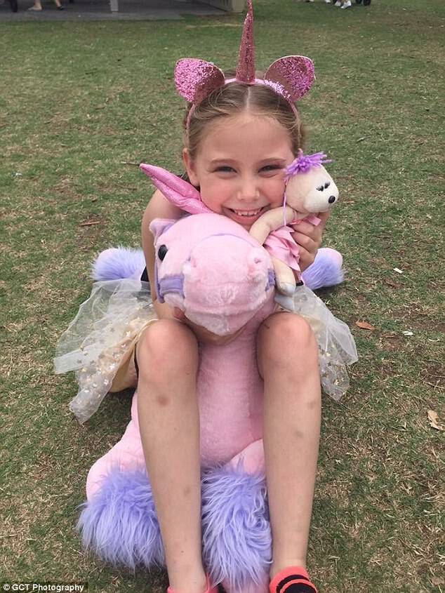 The party came a week after Mia (pictured with a unicorn gifted by a stranger) was left devastated after only two children from her school showed up to her birthday party 