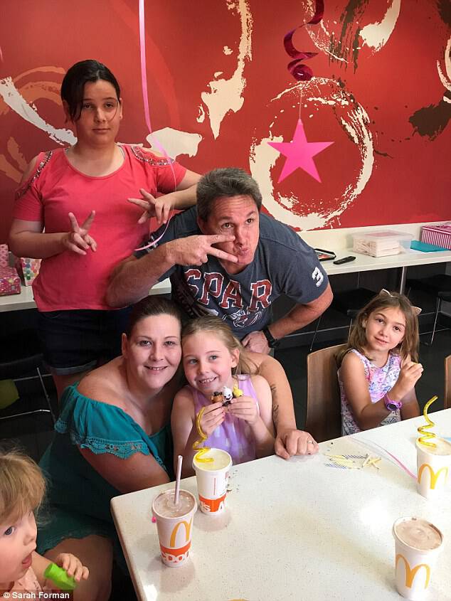 Mia put on a brave face during her McDonald's birthday (pictured). Meanwhile, her mum Sarah posted that there were free cheeseburgers on her community's 'Buy and Swap' Facebook page