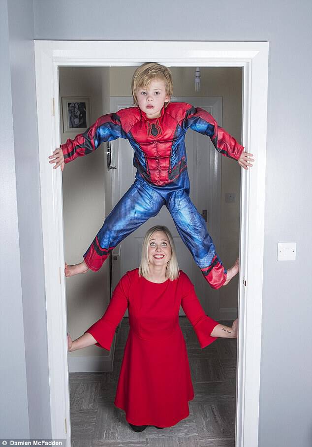 Ethan Broughton, pictured with his mother Sharon, has developed an obsession with climbing and has been dubbed 'Spider-Boy'