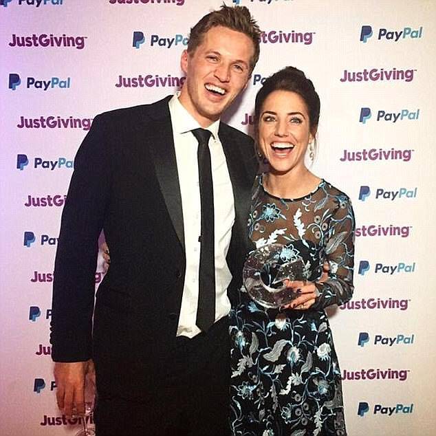 The couple are pictured here after winning a JustGiving award after raising tens of thousands of pounds for charity 