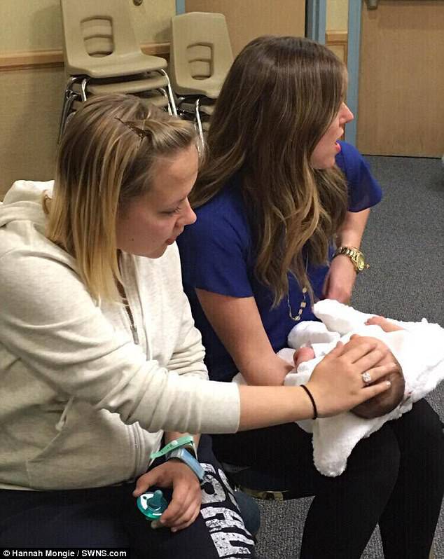 Birth mother Hannah Mongie with her baby Taggart and his adoptive parent Emily Marsh in March 2016