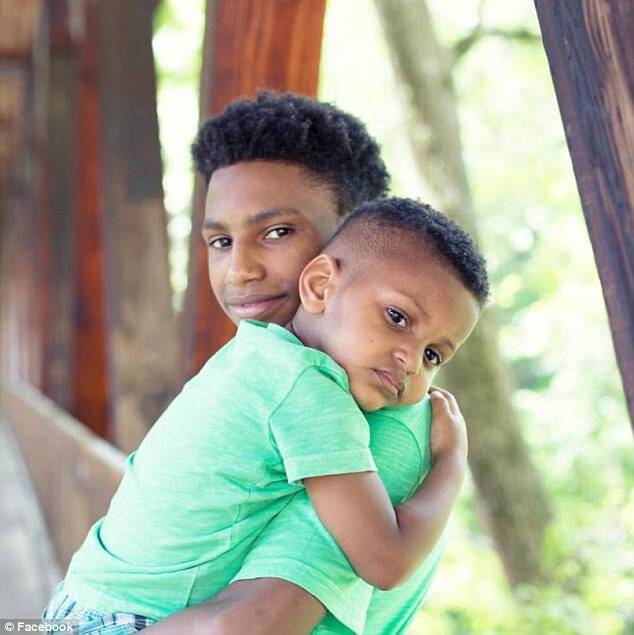 Outside of the classroom, Robinson and his baby brother, Jace (pictured together) spent most nights with their grandparents, who cared for them, along with Robinson's birth mom at the time Robinson was a troublesome student