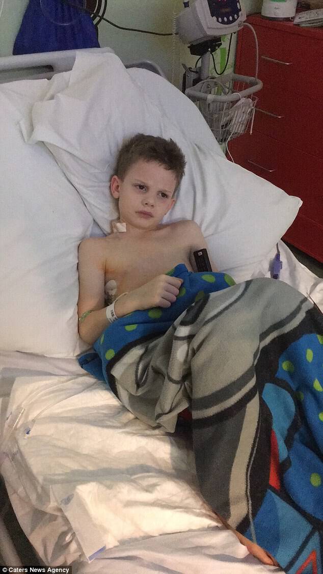 Oliver (pictured in hospital) was diagnosed with non-Hodgkin's lymphoma at just six-years-old
