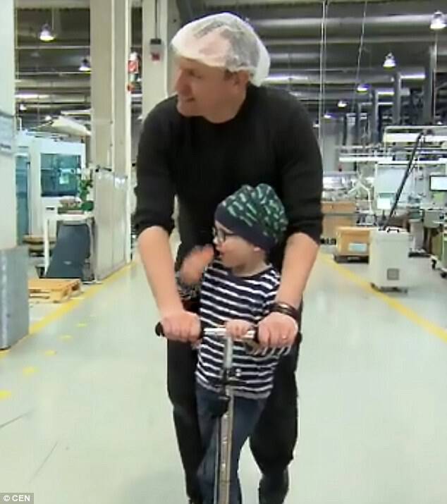 Factory workers donated 3,300 hours of overtime so their colleague Andreas Graf, 36, could be with his young son Julius (pictured together) as he battled leukaemia