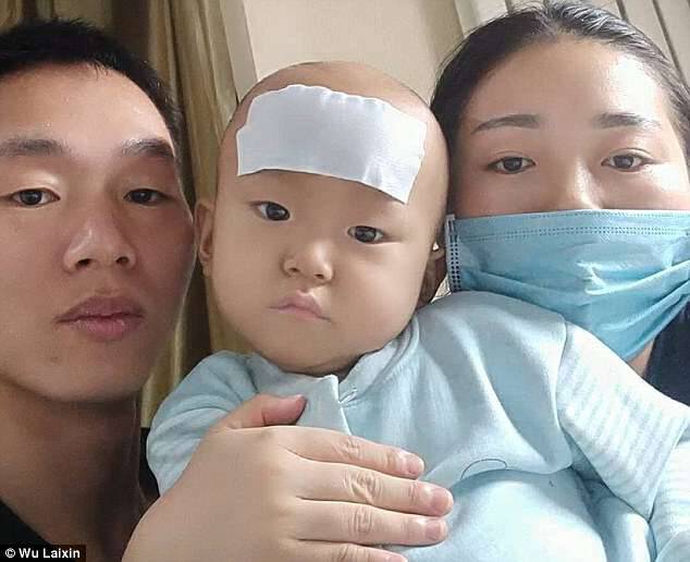 Wu Tianyi is pictured with his parents at theÂ Beijing Aerospace Central Hospital