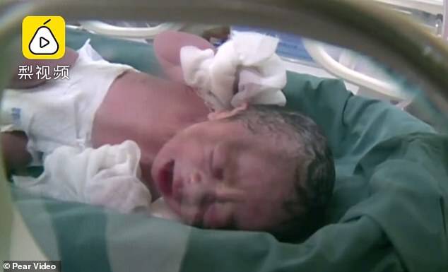 Footage released by Pear shows the newborn boy resting in an incubator at the hospital
