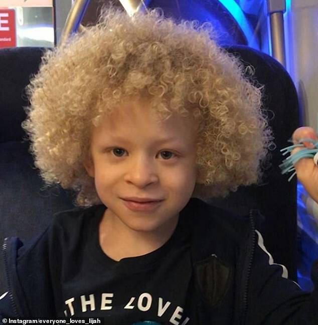 Lucy Dawes, of the West Midlands, posted a photo of her children baking on a local Facebook group. Users immediately noticed the 'striking' looks of her five-year-old son Elijah, pictured, who is of British and Nigerian descent but has light skin and white hair because of his albinism