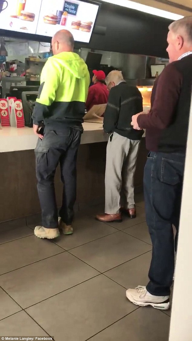Tradie Dave Love (pictured left) notices the elderly gentleman sifting through heaps of coins and is shown paying for both orders with his card